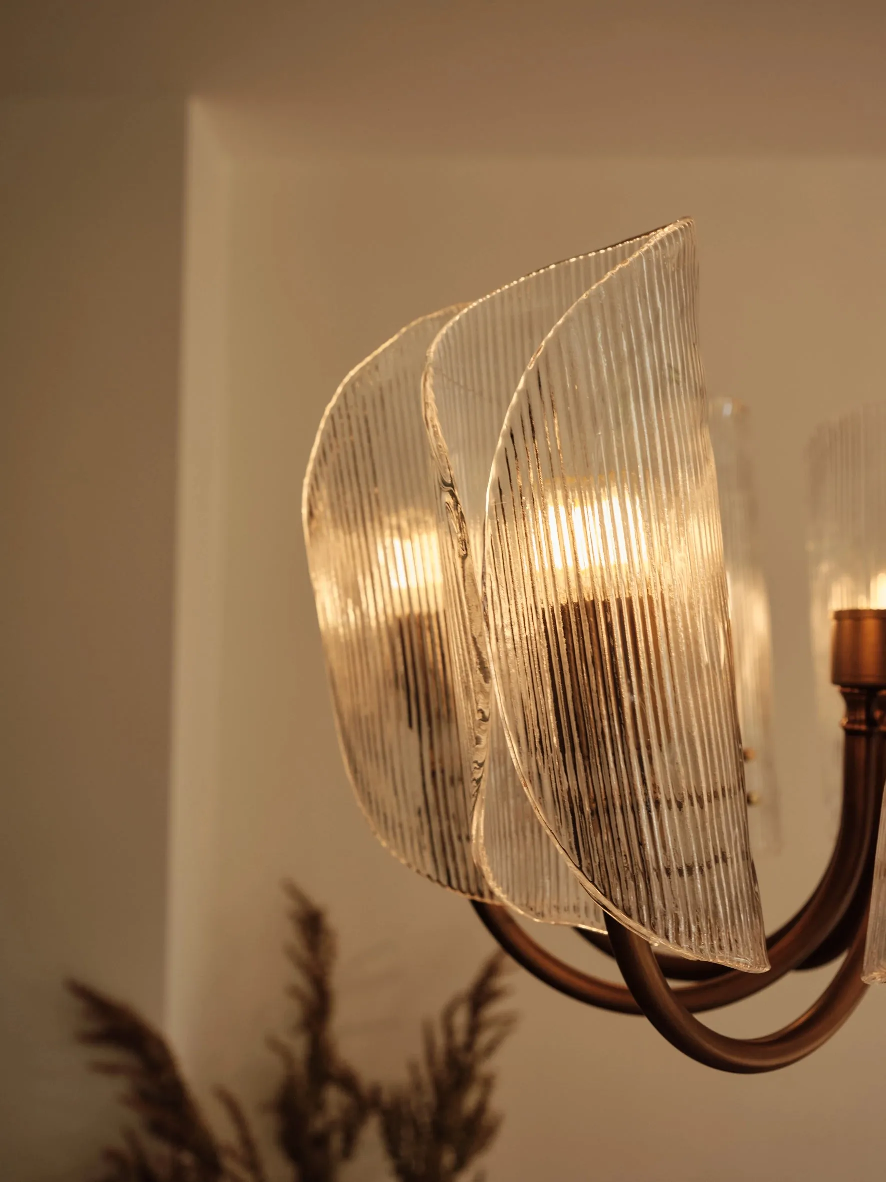 Cannoli - 10 light aged brass and textured glass chandelier